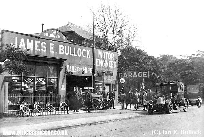 James Bullock's garage with various cars outside
