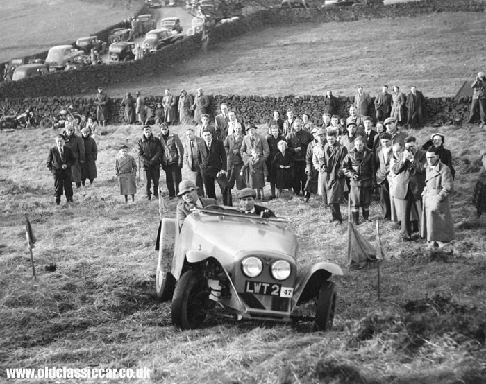 An old car competing at a trial