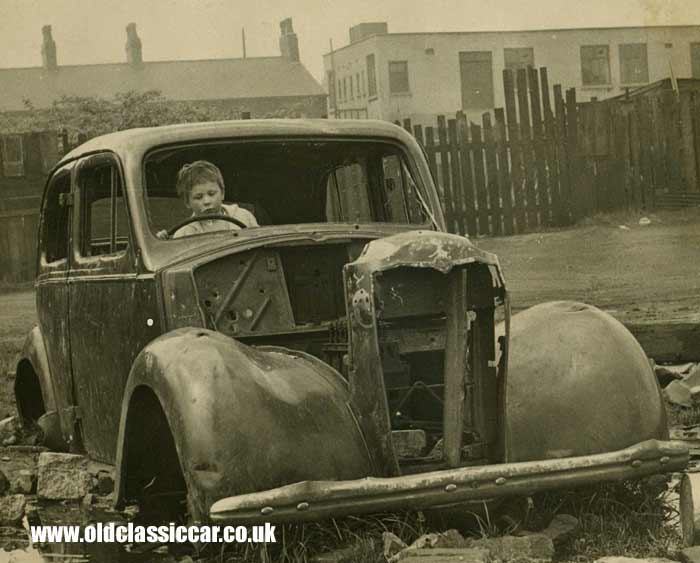 A pre-war Vauxhall dumped on waste ground