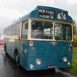 Classic coach rests outside the hangar