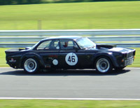 Highly modified V12 Jaguar XJC goes down the Avenue at Oulton Park