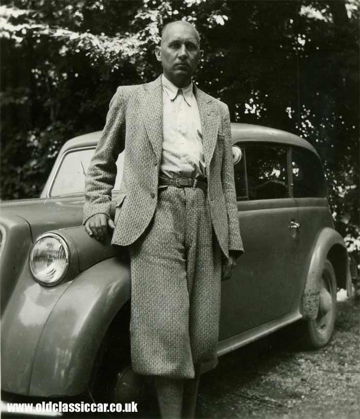 A proud car owner with his 1935/1936 Opel car