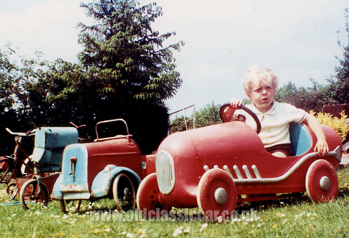 Martyn sat with his Triang pedal racing car and other classic rides 