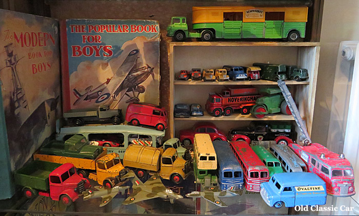 2nd shelf containing toy cars and lorries