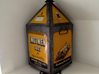 Rare oil tin featuring a 1950s racing car
