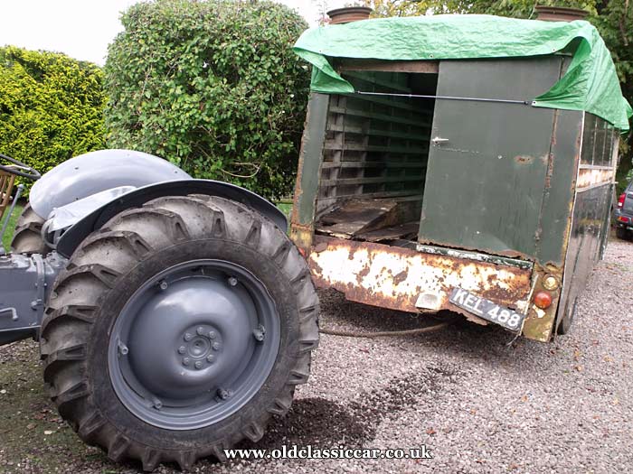 Moving it with the grey Ferguson tractor