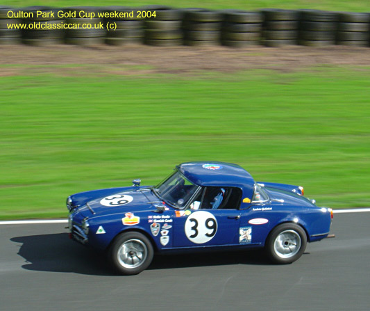 Classic Alfa Romeo Giulia Spider car on this vintage rally