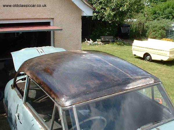 Once made good, the roof was treated with a layer of resin. A Portafold caravan is parked up in the background