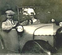 Two people in their Austin 7 tourer