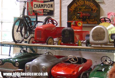 Collectors pedal cars and signs
