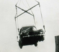 A crane lifts the Velox on board the ship