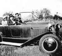 A family with their Citroen B2 car