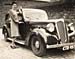 Lady seen with a 1930s car