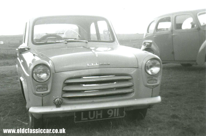 A Ford 100E parked alongside an earlier Prefect