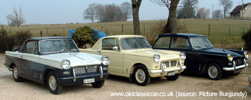 Two Herald Coupes plus a saloon