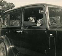 Driver behind the Hillman's steering wheel