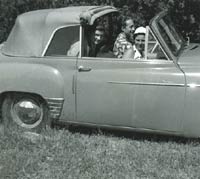 Three people in a Hillman Minx