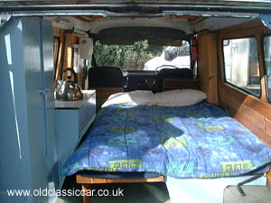 Camper interior showing the double bed