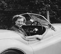 A driver in her XK120 sportscar