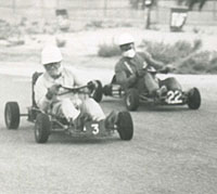 Three karts go wheel-to-wheel