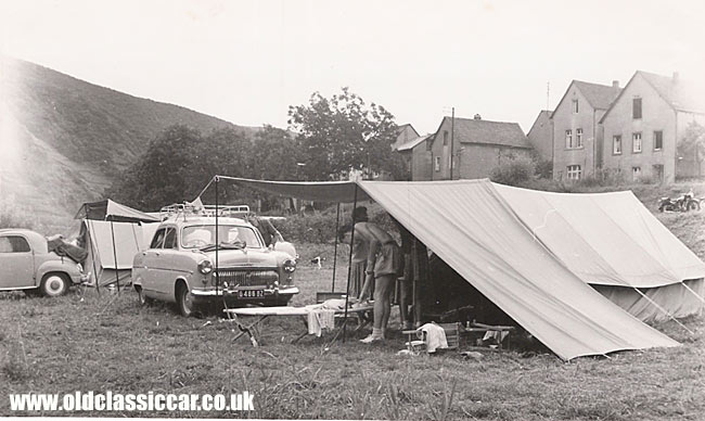 A fifties Ford parked in a field