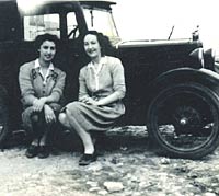 Vintage Morris Minor with two ladies for company