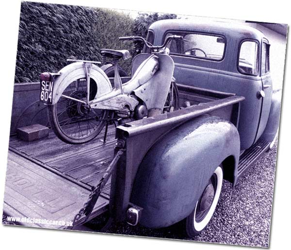 Moped is delivered in an old American truck