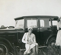 The 1931 Singer parked in a field