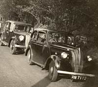 Two pre-war cars parked together