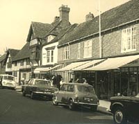 Cars and vans parked in a street