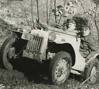 The 1172cc Ford climbs a muddy hill