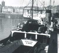 A 1950s Vauxhall being loaded onto a ship