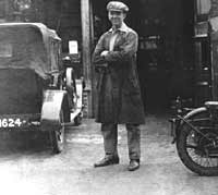 An owner stood outside a vintage car garage