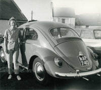 A lady with her VW Beetle