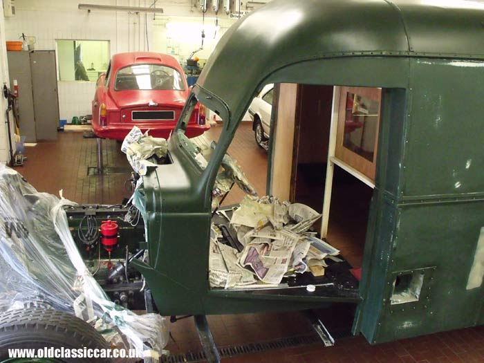 Applying the second undercoat to the Dodge truck