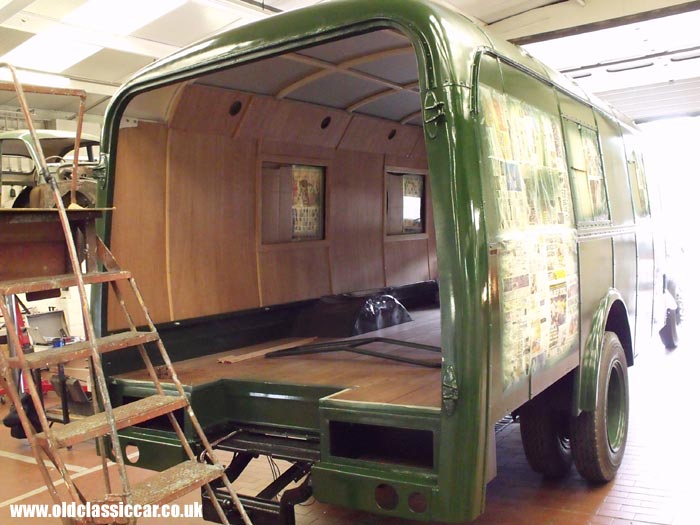 More paint is applied to the truck's bodywork