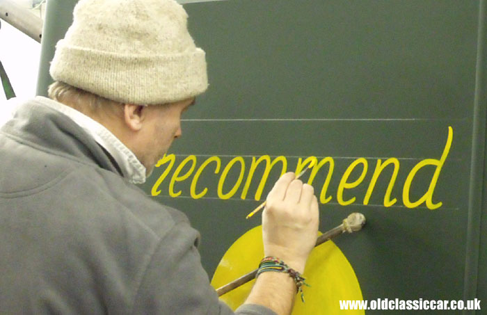 Applying the signwriting to the rear doors