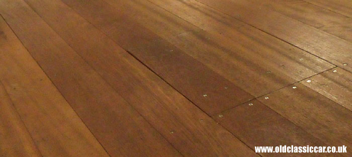 Stained wooden flooring in the back of the truck