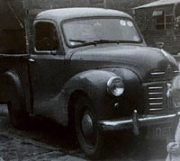 An A40 pickup in a farmyard