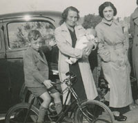 A boy on a bike in the 1930s