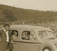 Side view, parked next to fields