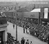 Crowds line the street outside