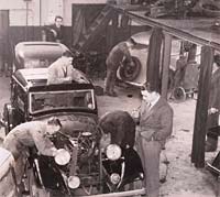 Cars being worked on at Lower Ford St garage