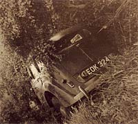 The crashed Minx in a hedge