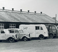 Two Jowett Bradfords and other vehicles