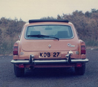 Rear view of yellow MGB GT