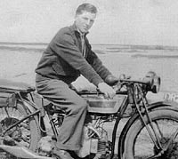A photo from the 1930s of a motorcyclist and his bike