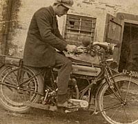 A gent sat on his vintage motorcycle