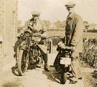 Two vintage motorcycles and riders