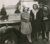 RAF chap with sportscar and two ladies